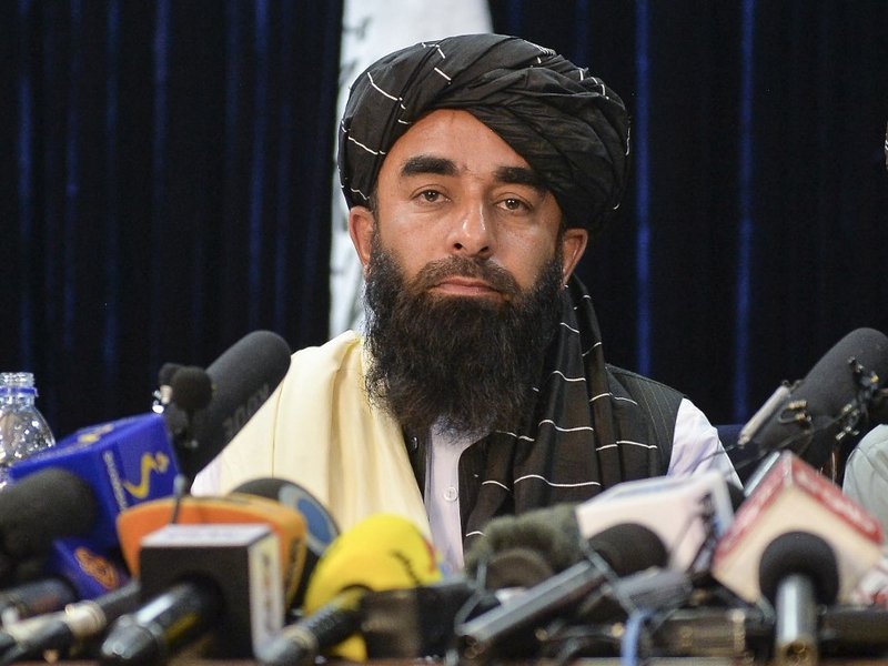 Taliban spokesperson Zabihullah Mujahid looks on as he addresses the first press conference in Kabul on August 17, 2021 following the Taliban stunning takeover of Afghanistan