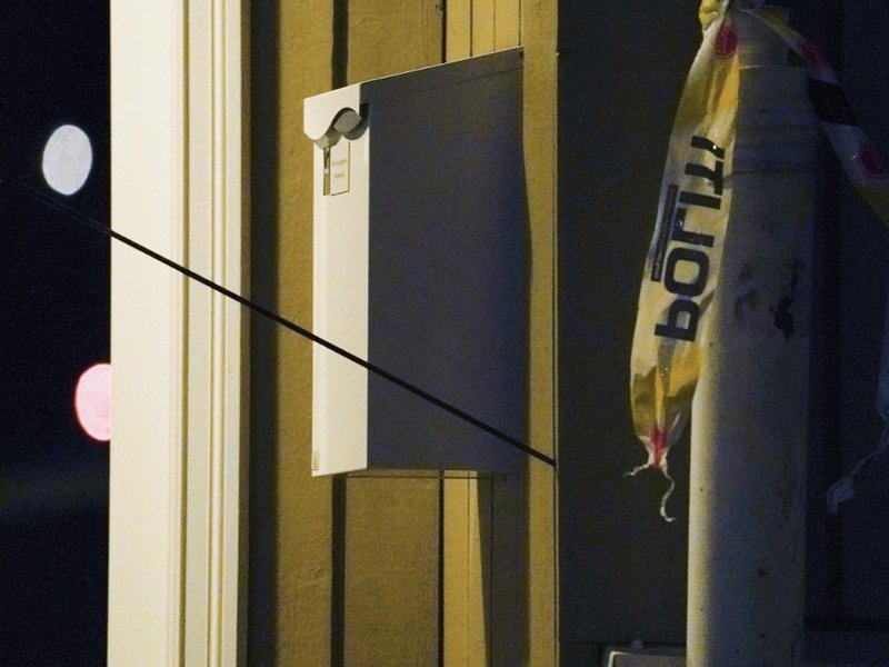 An arrow is left in a wall at the scene where a man armed with bow killed several people before he was arrested by police in Kongsberg, Norway, on October 13, 2021. A man armed with a bow and arrows killed several people and wounded others in the southeas