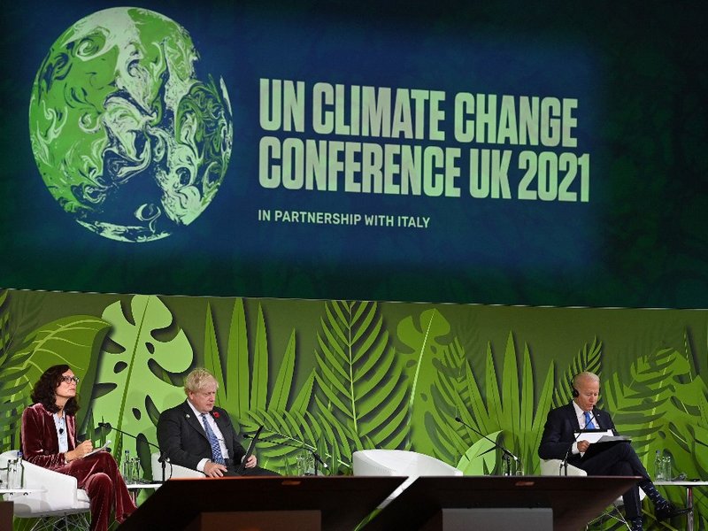 Britain's Prime Minister Boris Johnson (2L), and US President Joe Biden (R) listen to a speaker during an Action on Forests and Land Use session, during the COP26 UN Climate Change Conference in Glasgow, Scotland on November 2, 2021. World leaders meeting