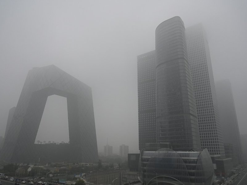 Buildings are seen in the central business district on a polluted day in Beijing on November 5, 2021.