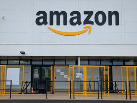 A picture shows the Amazon logo on the frontage of an Amazon's centre in Bretigny-sur-Orge, on December 14, 2021.