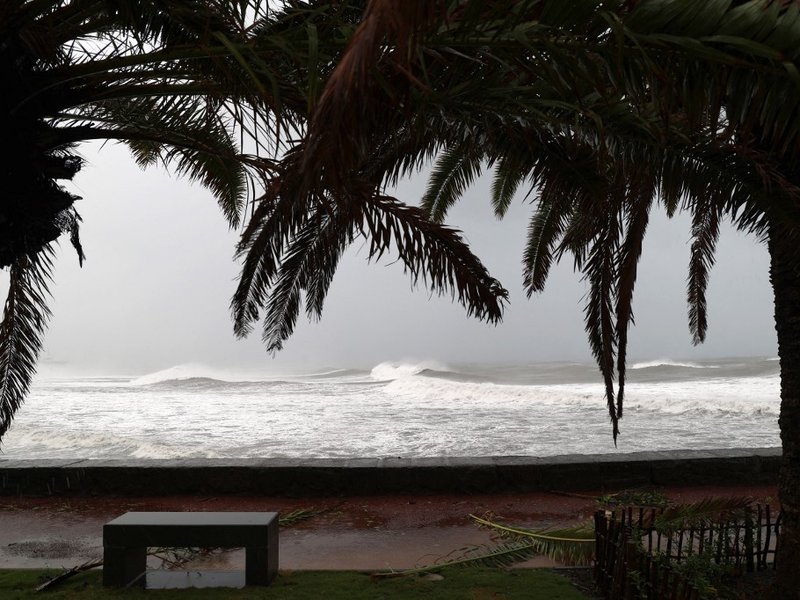A photograph shows raging waves on the north of the French Indian Ocean island of La Reunion in Saint-Denis de la Reunion on February 3, 2022, as the island was placed under a cyclonic red alert, forcing the 860,000 inhabitants to barricade themselves wit