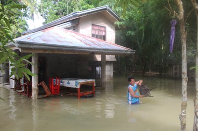 Tropical storm leaves towns submerged, 76 dead in Philippines