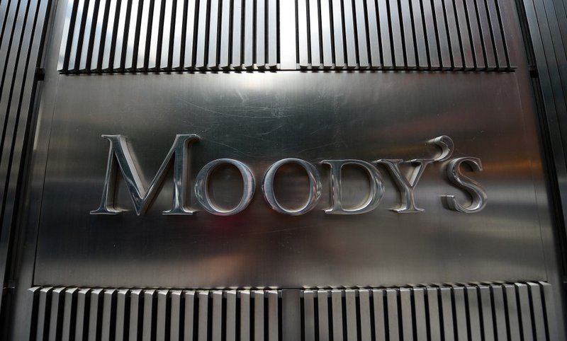 A sign for Moody's rating agency is displayed at the company headquarters in New York, September 18, 2012.