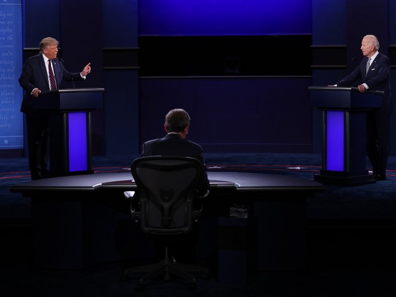 U.S. President Donald Trump and Democratic presidential nominee Joe Biden participate in the first presidential debate moderated by Fox News anchor Chris Wallace (C) at the Health Education Campus of Case Western Reserve University on September 29, 2020 i