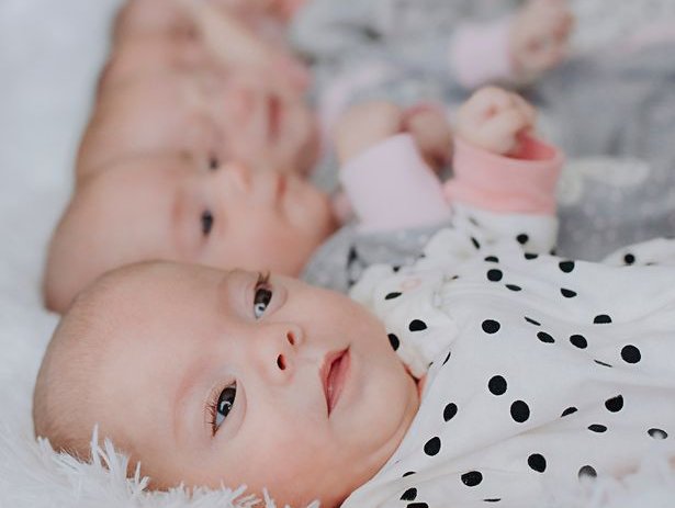 Lesbian couple who wanted 'one more baby' welcome quintuplets - and all are girls