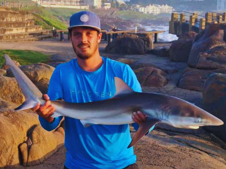 Warren Sommerville with a grey shark off Margate pier
