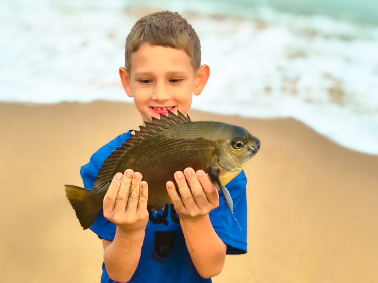 Cohan Hean with a Bronze Bream caught down the South Coast