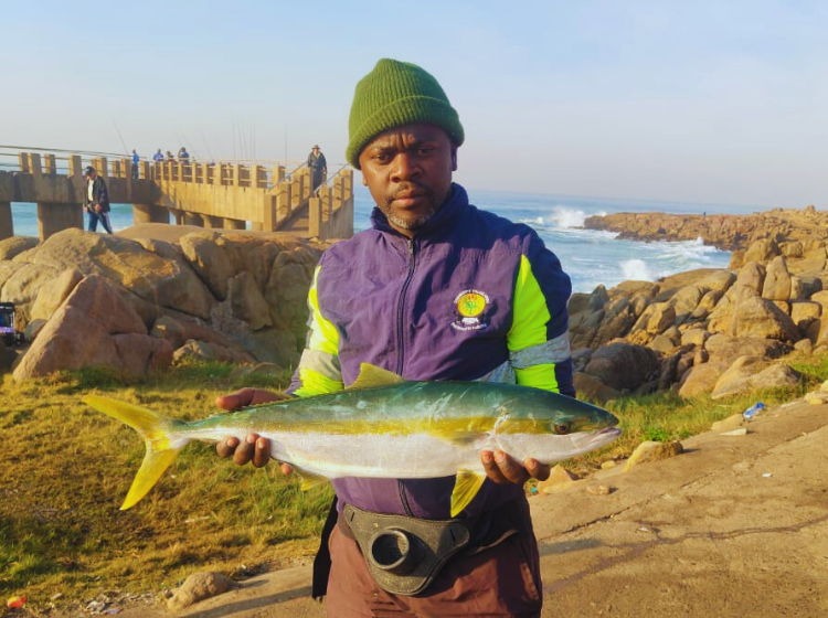 Mlungisi Mbambo with a Yellowtail caught off Margate Pier