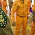 Correctional services badge and prisoners uniform