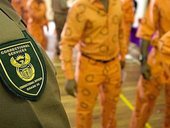 Correctional services badge and prisoners uniform
