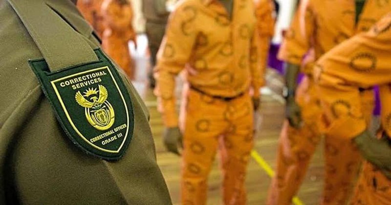 Correctional services badge and prisoners uniform