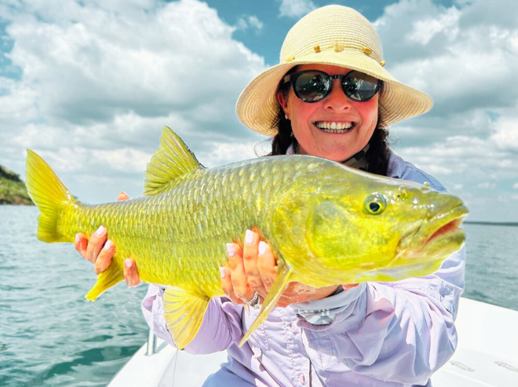 Tameryne Price with hands full of gold being a Yellow Fish from Sterkfontein