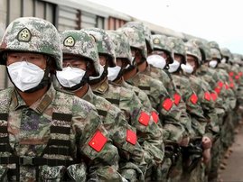 This screen grab obtained from a handout video released by the Russian Defence Ministry on August 29, 2022, shows Chinese soldiers marching along a railway platform upon their arrival for 'Vostok-2022' military exercises at the Sergeevsky training ground