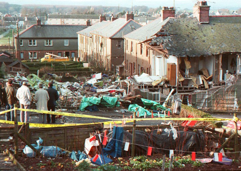 In this file photo taken on December 22, 1988 residents look at the scene of devastation in Lockerbie, after a 747 Pan Am Jumbo jet exploded and crashed over the town the day before on the route to New-York, with 259 passengers on board. A Libyan man accu