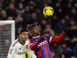 Manchester United midfielder Casemiro (L) and Crystal Palace's Wilfried Zaha