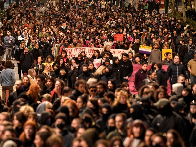 Thousands march during a rally to mark the International Women's Day as multiple demonstrations took place during a nationwide day of mass strikes and protests over the country's worst rail tragedy that killed 57 people last week in Athens, on March 8, 20