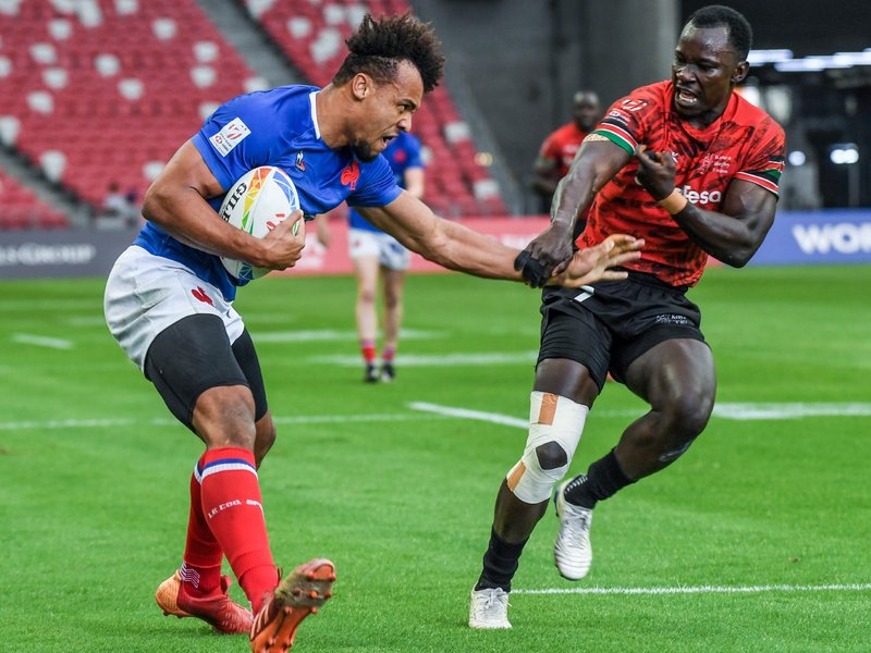 Jordan Sepho of France (L) fights for the ball against Tony Omondi of Kenya