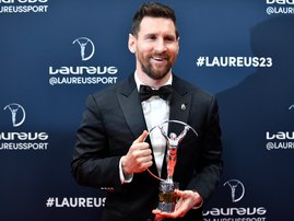 Lionel Messi poses with his Laureus World Sportsman of the Year award