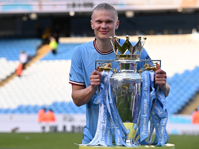 Manchester City's Erling Haaland poses with Premier League trophy