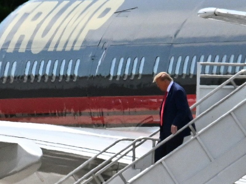 Former US President Donald Trump disembarks "Trump Force One"