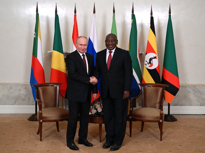 Russian President Vladimir Putin shaking hands with President Cyril Ramaphosa