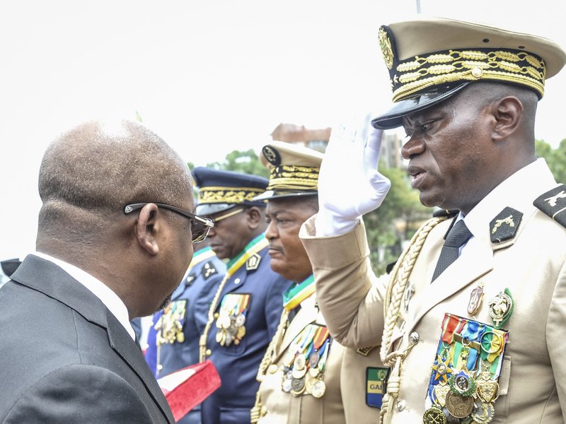 Head of Gabon's elite Republican Guard, General Brice Oligui Nguema (R)