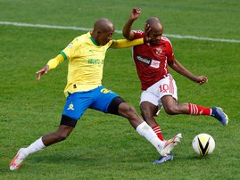 Ahly's Percy Tau fights for the ball with Sundowns' #25 Khuliso Mudau