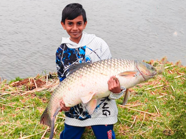 Austin Moodley with a massive Carp caught during his school holidays