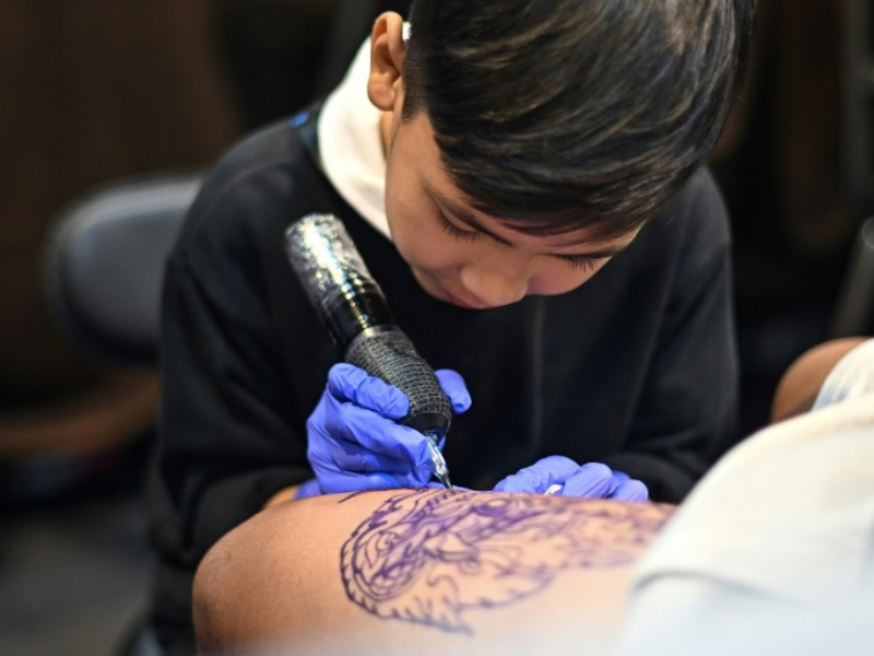 WATCH: Nine-year-old Thai tattooist makes his mark