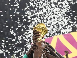 Senegal's players hold the trophy after winning the Africa Cup of Nations (CAN) 2021 final