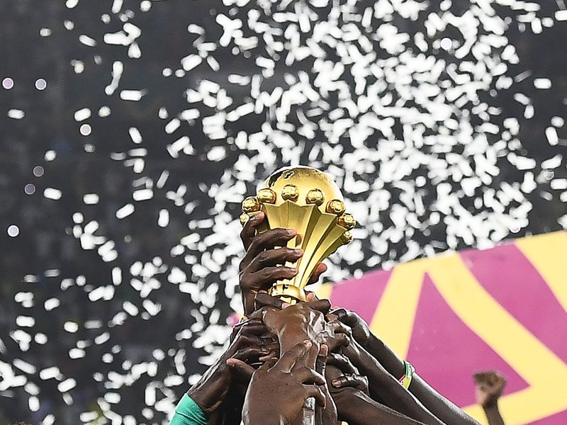 Senegal's players hold the trophy after winning the Africa Cup of Nations (CAN) 2021 final