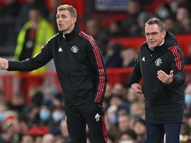 Manchester United's Scottish technical director Darren Fletcher (L) and Manchester United German Interim head coach Ralf Rangnick (R) gesture on the touchline during the English Premier League football match