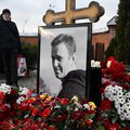 A man pays tribute to Russian opposition leader Alexei Navalny at his grave at the Borisovo cemetery in Moscow