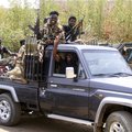 Sudanese army soldiers celebrate as they patrol in Salha, south of Omdurman, two days after the Sudanese army recaptured it from the paramilitary Rapid Support Forces (RSF)
