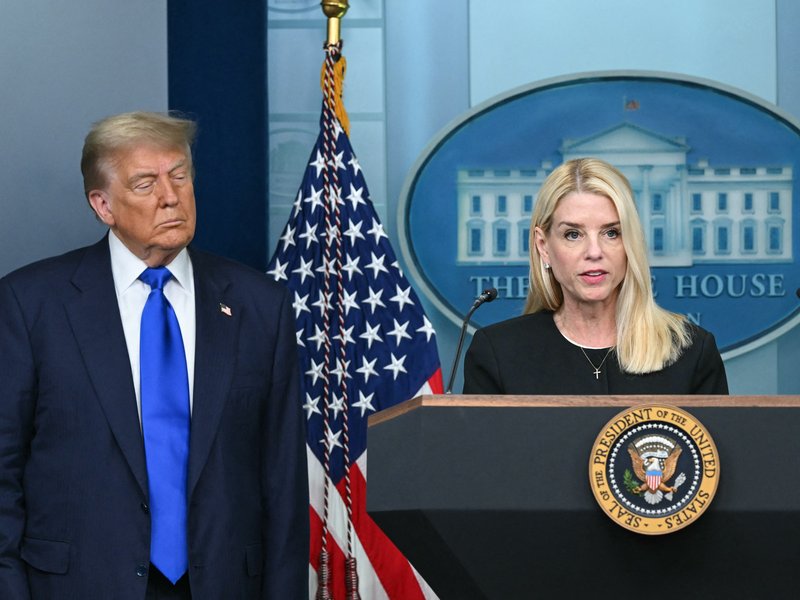 US Attorney General Pam Bondi (R) speaks during a news conference with President Donald Trump