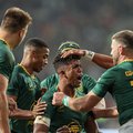 South Africa's centre Canan Moodie (C) celebrates with teammates after scoring a try during the international rugby union Test match between South Africa and Italy