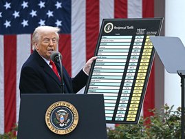 US President Donald Trump holds a chart as he delivers remarks on reciprocal tariffs