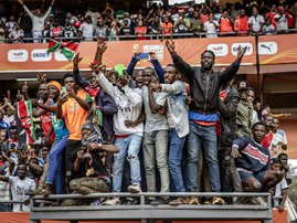 Kenyan fans react as they watch from an elevated platform during during the African Nations Championship (CHAN)