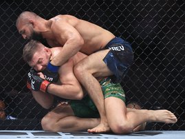 Khamzat Chimaev of the United Arab Emirates grapples with Dricus du Plessis of South Africa