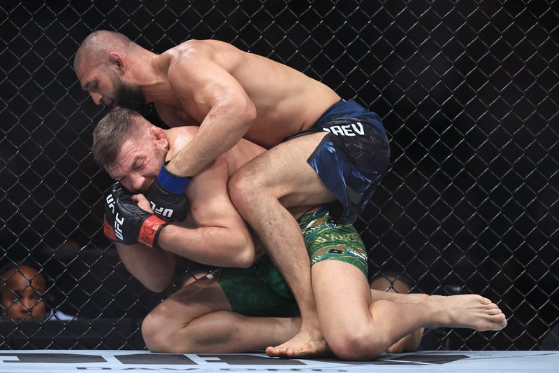 Khamzat Chimaev of the United Arab Emirates grapples with Dricus du Plessis of South Africa