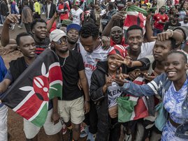 Supporters of Kenya cheer for their team following their victory against Zambia during the African Nations Championship