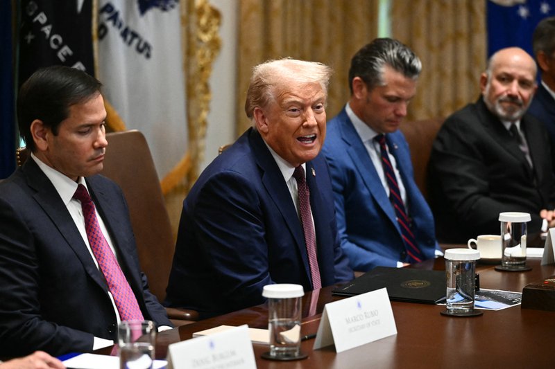 US President Donald Trump speaks during in a cabinet meeting, alongside Secretary of State Marco Rubio (L), Secretary of Defense Pete Hegseth