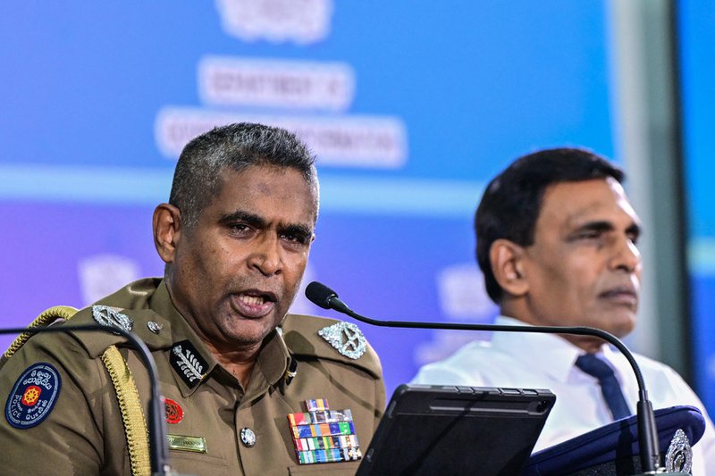 Sri Lanka's Inspector General of Police Priyantha Weerasooriya (L) speaks as Minister of Public Security Ananda Wijepala looks on during a press conference in Colombo on August 28, 2025. Sri Lanka's most wanted man has been arrested in Indonesia