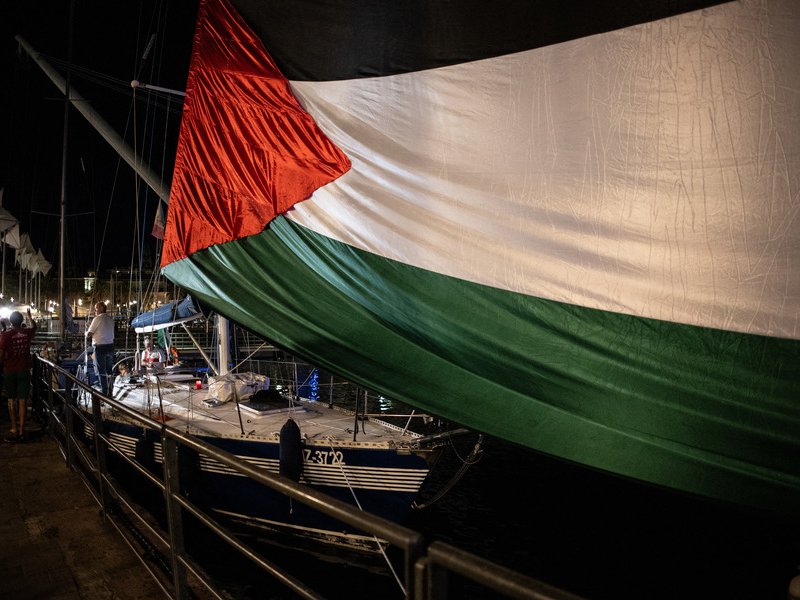 A giant Palestinian flag is deployed where four boats will leave to Gaza joining the “Global Sumud Flotilla”