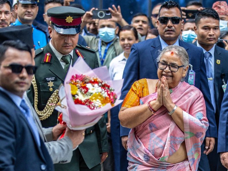 Officials greet newly-elected Prime Minister of Nepal's interim government Sushila Karki