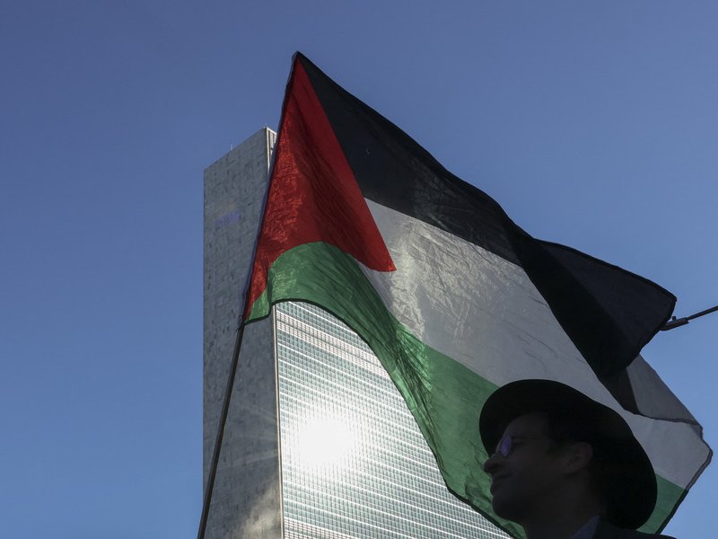 Pro-Palestinian protesters rally outside of the United Nations Headquarters ahead of the 80th General Assembly