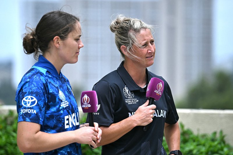 New Zealand's captain Sophie Devine (R) and her England's counterpart Nat Sciver-Brunt speak to media ahead of the 2025 ICC Women's Cricket World Cup