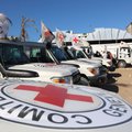 Red Crescent vehicles and refrigerated trucks are parked at the Nasser hospital in Khan Yunis in the southern Gaza Strip