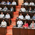 Sri Lanka's President Anura Kumara Dissanayake (C) presents the 2026 budget to parliament in Colombo on November 7, 2025.